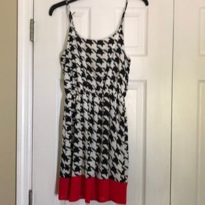 Black and white dress with red bow and trim